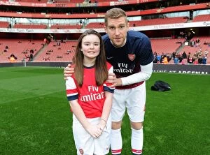 Arsenal v Fulham 2013-14 Collection: Arsenal mascot with Per Mertesacker (Arsenal). Arsenal 2: 0 Fulham. Barclays Premier League