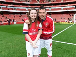 Images Dated 18th January 2014: Arsenal mascot with Santi Cazorla (Arsenal). Arsenal 2: 0 Fulham. Barclays Premier League