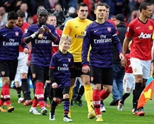 Images Dated 3rd November 2012: Arsenal Mascot walks out with Thomas Vermaelen (Arsenal). Manchester United 2: 1 Arsenal