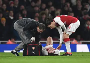Arsenal V Everton 2017-18 Prints: Arsenal: Mkhitaryan Receives Treatment as Bellerin Looks On during Arsenal v Everton