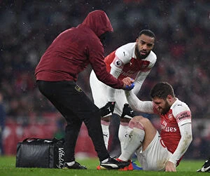 Images Dated 29th January 2019: Arsenal: Mustafi Receives Attention from Physio Amid Injury Scare vs. Cardiff City (2018-19)