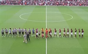 The Team Collection: The Arsenal and Newcastle team shake hands before the match