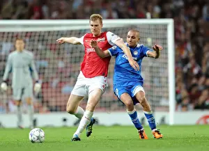 Arsenal V Olympiacos 2011-12 Prints: Arsenal Overcomes Olympiacos: Per Mertesacker's Goal Secures 2-1 Victory in UEFA Champions League Group F