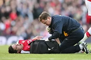Images Dated 18th October 2008: Arsenal physio Colin Lewin with injured Samir Nasri