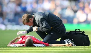 Blackburn Rovers V Arsenal 2008-9 Prints: Arsenal physio Colin Lewin treats the injured Gael Clichy