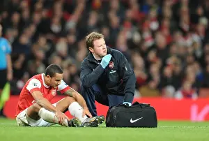 Arsenal V Stoke City 2010-2011 Prints: Arsenal physio Colin Lewin treats injured Theo Walcott. Arsenal 1: 0 Stoke City