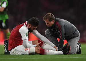 Arsenal V Doncaster Rovers - Carabao Cup 2017-18 Prints: Arsenal physio Colin Lewin treats Olivier Giroud (Arsenal). Arsenal 1: 0 Doncaster