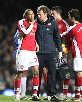 Chelsea v Arsenal 2008-09 Collection: Arsenal physio Colin Lwein treats Gael Clichy