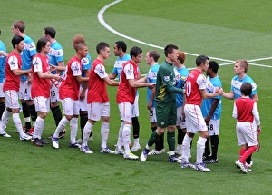 The Arsenal player shake hands with the Sunderland team before the match The Arsenal player shake hands with the Sunderland team before the match