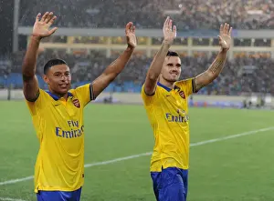 Vietnam V Arsenal 2013-14 Prints: Arsenal Players Alex Oxlade-Chamberlain and Carl Jenkinson Wave to Fans after Vietnam Friendly Match