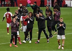 Arsenal V Brighton And Hove Albion 2020-21 Prints: Arsenal Players Celebrate with Fans After Securing Victory Against Brighton & Hove Albion (2020-21)