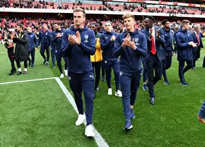 Arsenal Players Celebrate with Fans after Victory over Brighton & Hove Albion