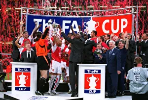 The Arsenal players celebrate lifting the FA Cup Trophy