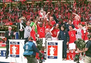 Trophies Collection: The Arsenal Players celebrate winning the FA Cup Trophy