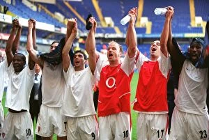 Images Dated 7th April 2005: Arsenal players celebrate winning the League (L>R) Lauren, Robert Pires