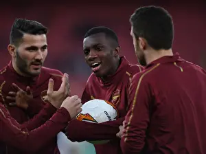 Arsenal Players Eddie Nketiah and Sead Kolasinac Warm Up Ahead of Arsenal v BATE Borisov UEFA Europa League Clash