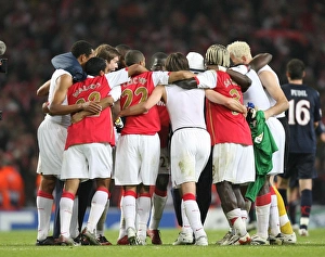 Arsenal players form a huddle at the end of the match