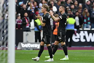 West Ham United V Arsenal 2022-23 Prints: Arsenal Players Granit Xhaka and Martin Odegaard Celebrate with Fans after West Ham Victory