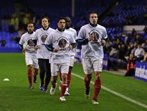 Everton v Arsenal 2011-12 Collection: Arsenal Players Honor Fabrice Muamba with Robin van Persie: Tribute T-Shirts Before Everton Match