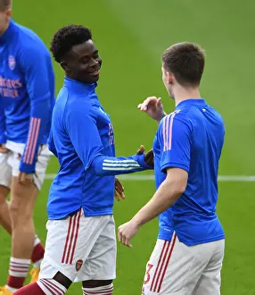 Arsenal V Manchester City 2020-21 Prints: Arsenal Players Kieran Tierney and Bukayo Saka Warm Up Ahead of Emirates Showdown