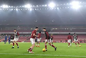 Arsenal Players Kieran Tierney and Hector Bellerin Warm Up Ahead of Emirates Stadium Showdown: Arsenal vs. Wolverhampton Wanderers (2020-21)