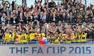 Images Dated 30th May 2015: The Arsenal players lift the FA Cup after the match. Arsenal 4: 0 Aston Villa. FA Cup Final