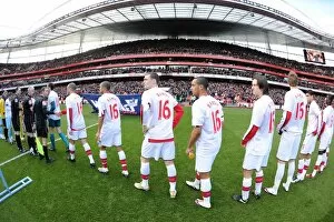 Arsenal players line up before the match wearing Aaron Ramsey shirts. Arsenal 3: 1 Burnley