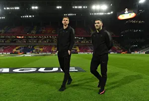 CSKA Moscow V Arsenal 2017-18 Prints: Arsenal Players Per Mertesacker and Sead Kolasinac Scout CSKA Moscow Pitch before Europa League Quarterfinal