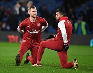 Chelsea v Arsenal - Carabao Cup 1/2 final 1st leg 2017-18 Collection: Arsenal Players Per Mertesacker and Theo Walcott Before Carabao Cup Semi-Final vs Chelsea