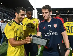 Angers SCO V Arsenal 2019-20 Prints: Arsenal Players Mkhitaryan and Willock Analyze Match Stats with Sports Scientist Allen