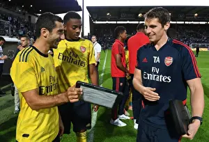 Angers SCO V Arsenal 2019-20 Prints: Arsenal Players Mkhitaryan and Willock Review Match Stats with Sports Scientist Allen