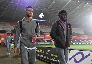 Swansea City V Arsenal 2017-18 Prints: Arsenal Players Shkodran Mustafi and Alex Iwobi Arrive at Swansea City Stadium before Premier League Match