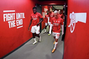 Images Dated 26th August 2023: Arsenal Players Thomas Partey and Leandro Trossard Prepare for Kick-off against Fulham in 2023-24