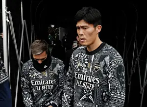 Arsenal Players Trossard and Tomiyasu Warm Up Ahead of Fulham Clash (Fulham v Arsenal 2023-24)