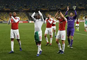 FC Vorskla Poltava V Arsenal 2018-19 Prints: Arsenal Players Zech Medley and Ainsley Maitland-Niles Celebrate with Fans after UEFA Europa League Match vs