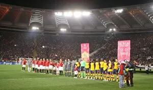 Arsenal and Roma teams line up before the match