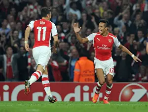 Arsenal V Galatasaray 2014/15 Champions League Prints: Arsenal: Sanchez and Ozil Celebrate Goals Against Galatasaray in 2014 Champions League