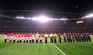 Arsenal and Slavia players with Kick Racism mascots