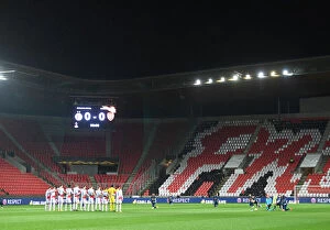 Slavia Prague v Arsenal 2020-21 Collection: Arsenal and Slavia Prague Players Unite in Silence: Taking a Knee before Empty Stands in UEFA