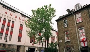 Images Dated 11th May 2006: Arsenal Stadium with a house on Conewood Street with Arsenal posters in the windows