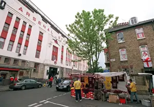 Arsenal Stadium with a house on Conewood Street with Arsenal posters in the windows