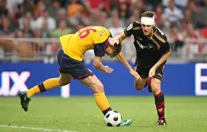 Arsenal V Seville Prints: Arsenal Stars Bendtner and Squillaci Clash in Amsterdam Tournament Draw