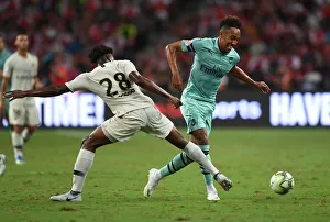 Arsenal Stars Clash: Aubameyang vs. Mbe Soh in Arsenal vs. PSG Showdown