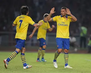 Indonesia Dream Team V Arsenal 2013-14 Prints: Arsenal Stars: Lukas Podolski and Tomas Rosicky Celebrate Goal Against Indonesia All-Stars