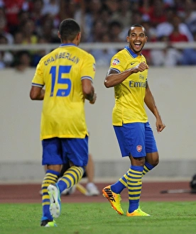 Vietnam V Arsenal 2013-14 Prints: Arsenal Stars: Oxlade-Chamberlain Scores, Walcott Celebrates in Vietnam Friendly, 2013