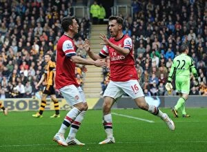 Hull City v Arsenal 2013/14 Collection: Arsenal Stars: Ramsey and Ozil Celebrate Goal in Hull City Victory, Premier League 2013-14