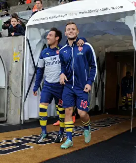 Arsenal Stars Santi Cazorla and Jack Wilshere Warm Up Ahead of Swansea Clash (2014-15)