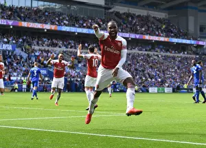 Arsenal Strikers Lacazette and Aubameyang Celebrate Goal Scoring Partnership in Premier League Match against Cardiff City