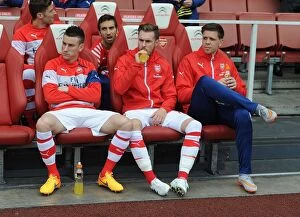 Arsenal v West Bromwich Albion 2014/15 Collection: Arsenal Substitutes: Koscielny, Ramsey, Szczesny - Ready on the Sidelines at Arsenal v West