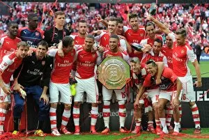 Images Dated 10th August 2014: Arsenal team celebrate winning the Community Shield. Arsenal 3: 0 Manchester City